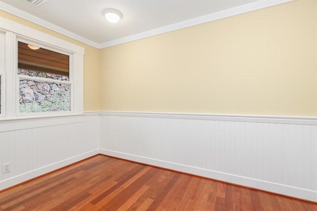 65-1104 Hokuula Rd, Kamuela, HI 96743 - unfurnished room featuring wood finished floors, wainscoting, ornamental molding, and baseboards