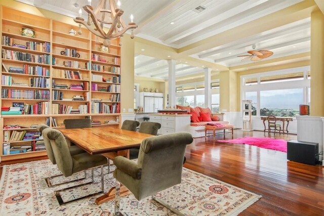 65-1104 Hokuula Rd, Kamuela, HI 96743 - sitting room with wood finished floors, ornamental molding, a chandelier, beam ceiling, and ceiling fan
