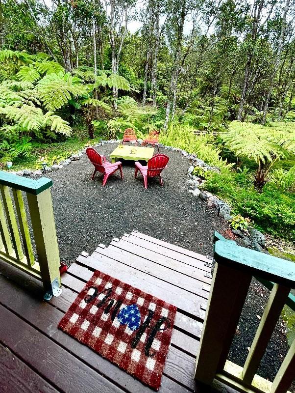 11-3324-A Mokuna St, Volcano, HI 96785 - view of yard with a wooden deck and view of wooded area