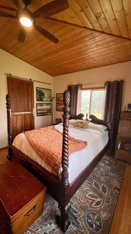 11-3324-A Mokuna St, Volcano, HI 96785 - bedroom with vaulted ceiling, wooden ceiling, and a ceiling fan