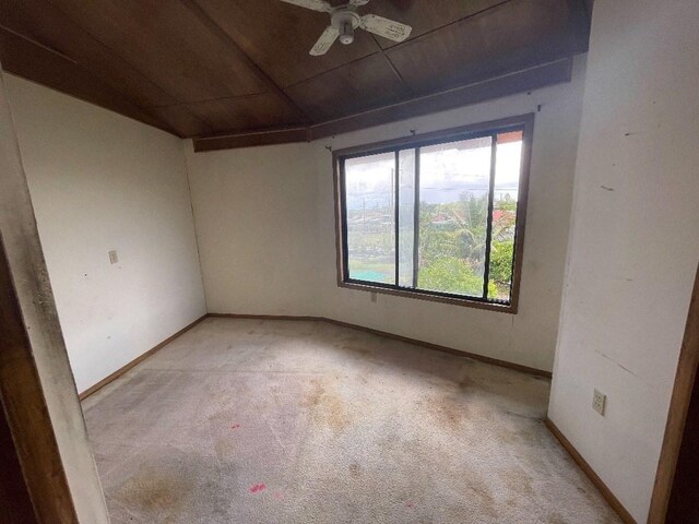 126 W Kinai Pl, Hilo, HI 96720 - empty room with light carpet, wooden ceiling, a ceiling fan, and baseboards