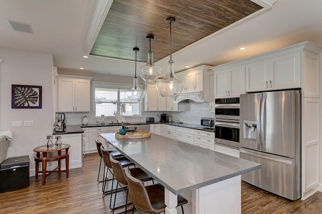 3047 Lou St, Hilo, HI 96720 - kitchen with stainless steel appliances, white cabinetry, dark wood-style floors, and recessed lighting