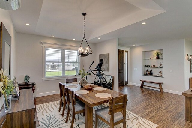 3047 Lou St, Hilo, HI 96720 - dining space with dark wood-style floors, a chandelier, built in shelves, baseboards, and recessed lighting