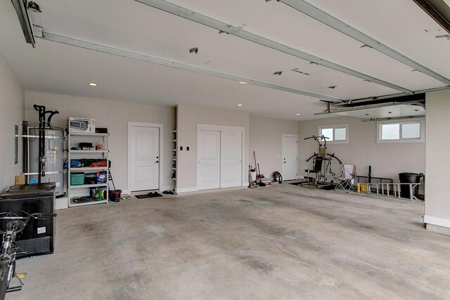 3047 Lou St, Hilo, HI 96720 - garage featuring strapped water heater and recessed lighting