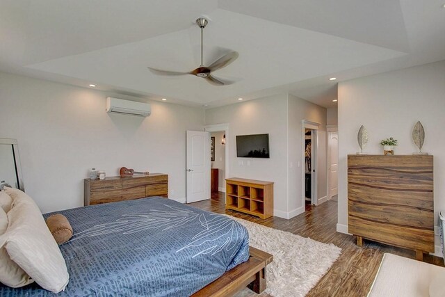3047 Lou St, Hilo, HI 96720 - bedroom featuring a wall mounted air conditioner, wood finished floors, ceiling fan, recessed lighting, and baseboards