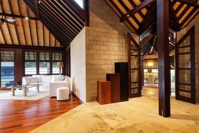 4221 Anini Vista Dr # A, Kilauea, HI 96754 - interior space with high vaulted ceiling, beam ceiling, wood finished floors, and ceiling fan