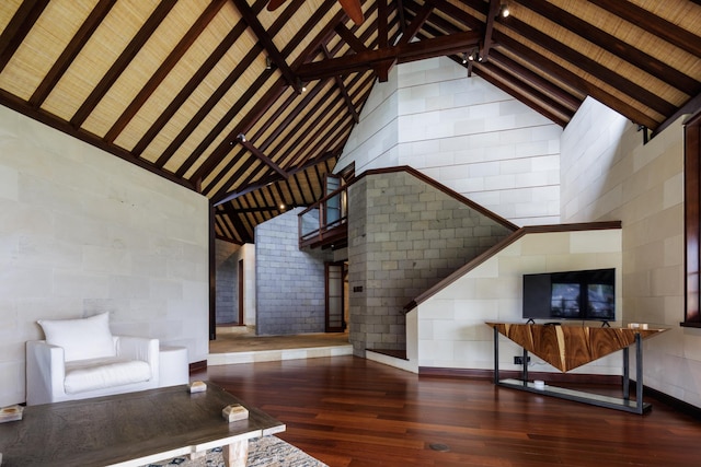 4221 Anini Vista Dr # A, Kilauea, HI 96754 - unfurnished living room featuring hardwood / wood-style floors, high vaulted ceiling, beamed ceiling, and arched walkways
