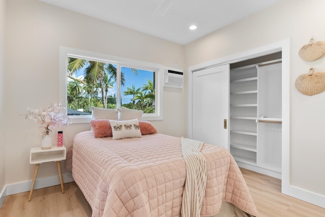 15-1757 4th Ave, Keaau, HI 96749 - bedroom with light wood-style flooring, baseboards, a wall unit AC, a closet, and recessed lighting