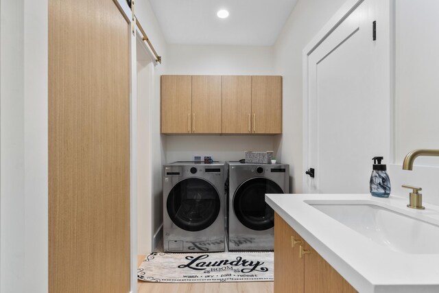 15-1757 4th Ave, Keaau, HI 96749 - washroom with cabinet space, washer and clothes dryer, and wood finished floors