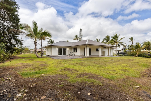 15-1757 4th Ave, Keaau, HI 96749 - back of property with metal roof and a yard