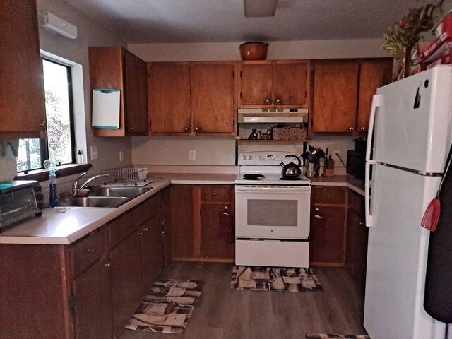 11-3193 Hibiscus St, Mountain View, HI 96771 - kitchen featuring white appliances, a sink, light countertops, under cabinet range hood, and dark wood-type flooring