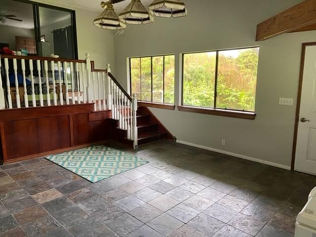 11-3193 Hibiscus St, Mountain View, HI 96771 - staircase featuring plenty of natural light, baseboards, and stone tile flooring