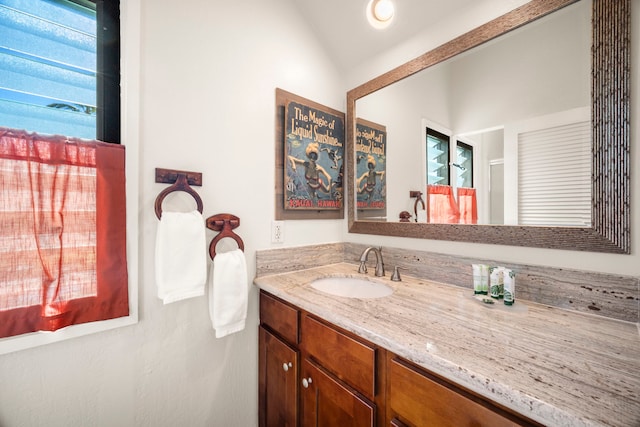 4460 Nehe Rd Unit 212, Lihue, HI 96766 - bathroom with vanity and vaulted ceiling