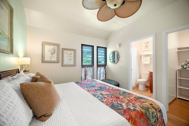 4460 Nehe Rd Unit 212, Lihue, HI 96766 - bedroom with lofted ceiling, ensuite bath, and a ceiling fan