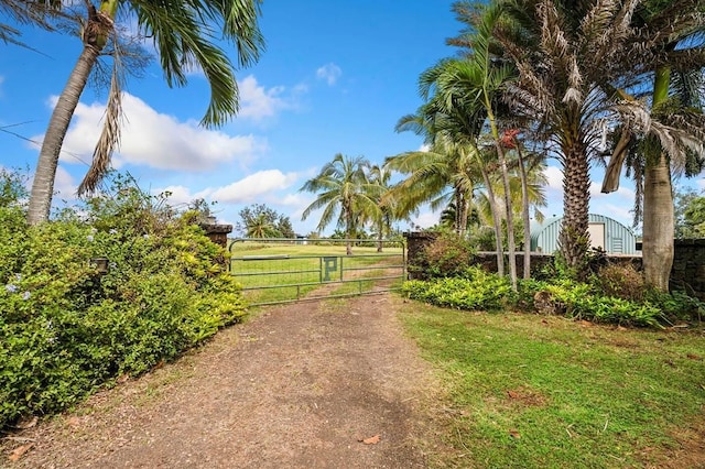 4-4940 Kuhio Hwy Unit A, Anahola, HI 96703 - view of dirt / gravel road with a gate and a gated entry
