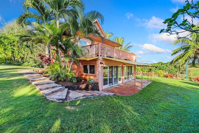 4-4940 Kuhio Hwy Unit A, Anahola, HI 96703 - back of house with a yard, a patio area, stucco siding, and a deck