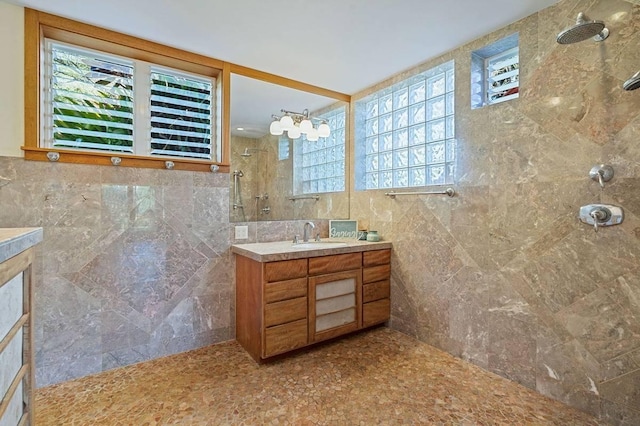 4-4940 Kuhio Hwy Unit A, Anahola, HI 96703 - bathroom with tiled shower, vanity, and tile walls