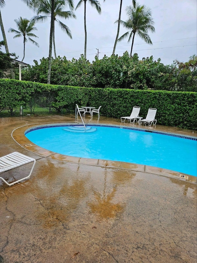 525 Aleka Lp Unit K3, Kapaa, HI 96746 - community pool with a fenced backyard and a patio area
