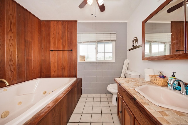 17-8160 N Kulani Rd, Mountain View, HI 96771 - bathroom featuring ceiling fan, a whirlpool tub, toilet, vanity, and tile patterned floors
