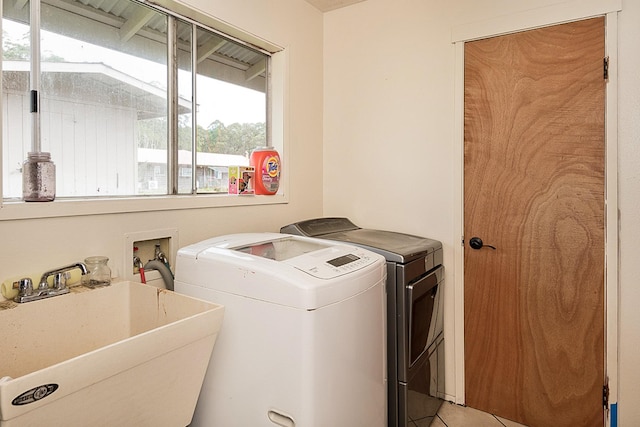 17-8160 N Kulani Rd, Mountain View, HI 96771 - laundry area with washer and clothes dryer and light tile patterned floors