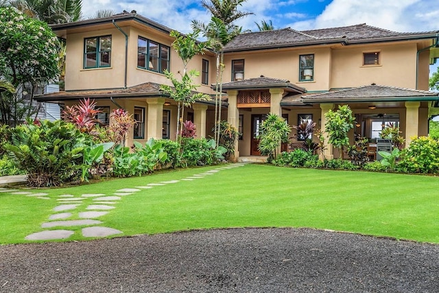 5070 Kukuna Rd, Anahola, HI 96746 - view of front of house with a front lawn and stucco siding