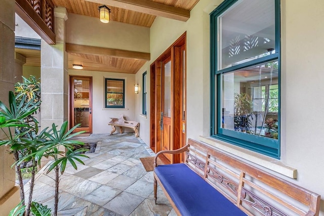 5070 Kukuna Rd, Anahola, HI 96746 - view of exterior entry with covered porch and stucco siding