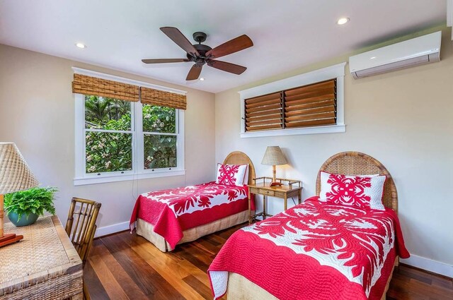 5070 Kukuna Rd, Anahola, HI 96746 - bedroom with an AC wall unit, baseboards, wood finished floors, recessed lighting, and a ceiling fan