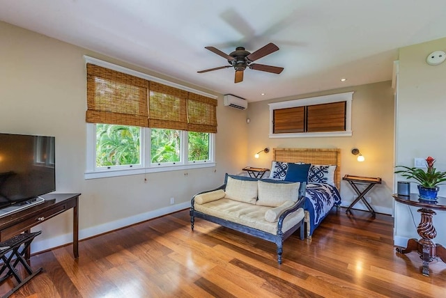 5070 Kukuna Rd, Anahola, HI 96746 - bedroom featuring wood finished floors, baseboards, a wall mounted air conditioner, and recessed lighting