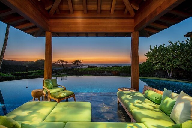 72-3023 Kakapa Pl, Kailua-Kona, HI 96740 - patio terrace at dusk featuring a gazebo, an outdoor hangout area, and a patio area