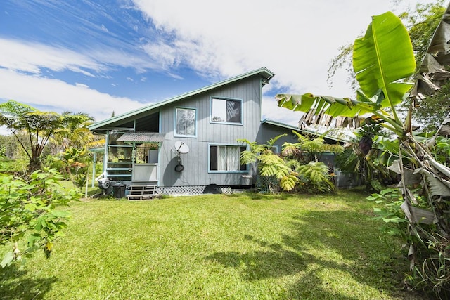 11-3171 Hibiscus St, Mountain View, HI 96771 - back of property featuring a lawn
