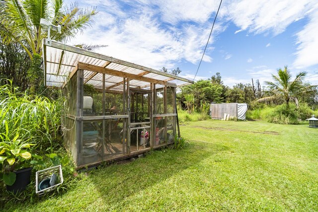 11-3171 Hibiscus St, Mountain View, HI 96771 - view of grassy yard featuring an outdoor structure