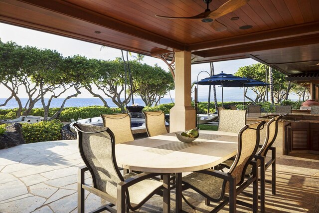 68-1015 Pauoa Way, Kamuela, HI 96743 - view of patio with outdoor dining space, ceiling fan, and a water view