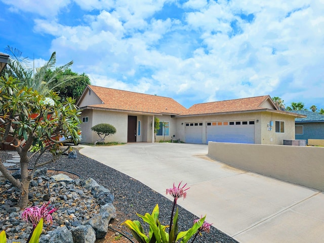68-1693 Malie St, Waikoloa, HI 96738 - ranch-style home with stucco siding, an attached garage, and driveway