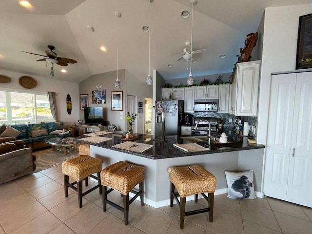 88-119 Kai Ave, Captain Cook, HI 96704 - kitchen featuring stainless steel appliances, a ceiling fan, open floor plan, vaulted ceiling, and a peninsula