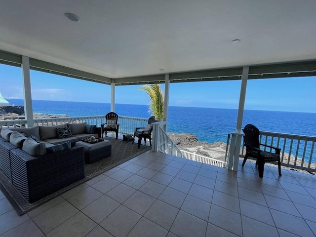 88-119 Kai Ave, Captain Cook, HI 96704 - sunroom / solarium with tile patterned flooring, a wall of windows, a water view, and plenty of natural light