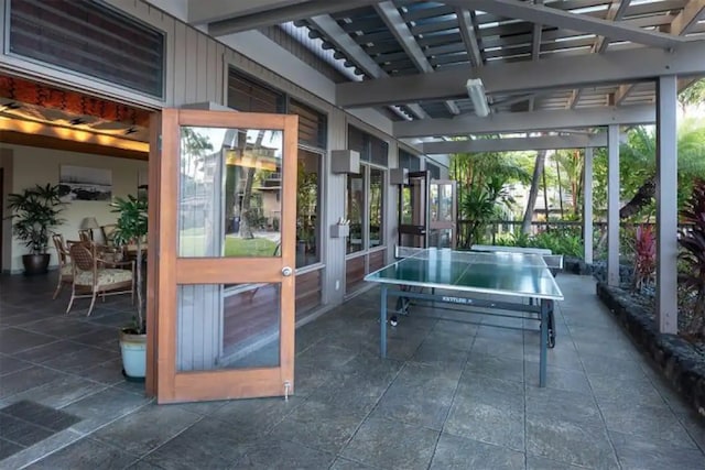 78-261 Manukai St Unit 201, Kailua-Kona, HI 96740 - sunroom with stone tile floors