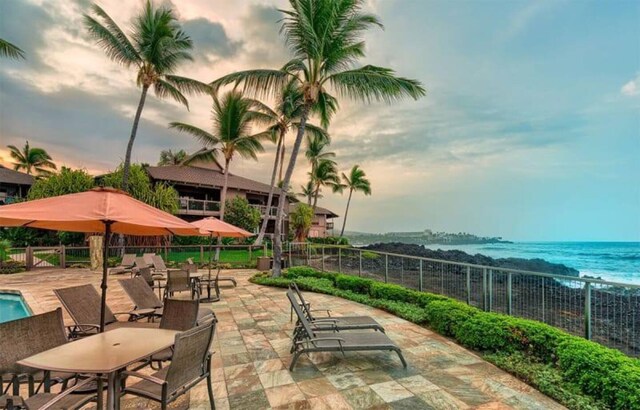 78-261 Manukai St Unit 201, Kailua-Kona, HI 96740 - patio terrace at dusk with a patio area and a water view