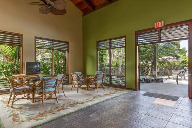 78-261 Manukai St Unit 201, Kailua-Kona, HI 96740 - dining room with high vaulted ceiling, ceiling fan, and wooden ceiling with exposed beams