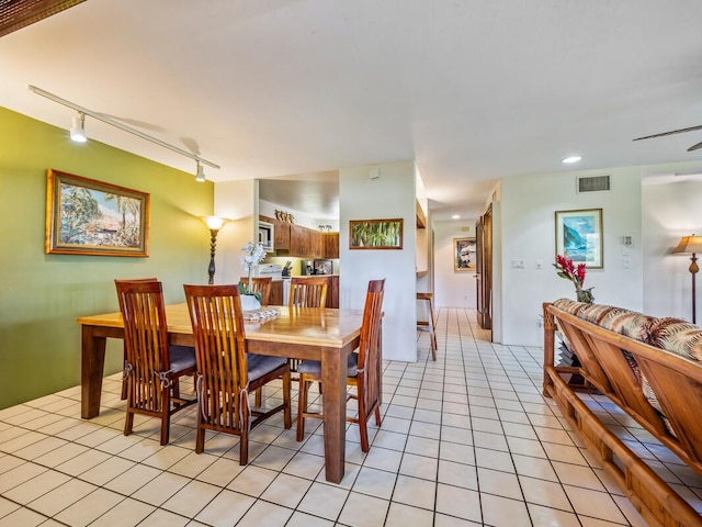 78-261 Manukai St Unit 201, Kailua-Kona, HI 96740 - dining space featuring track lighting, light tile patterned floors, and recessed lighting