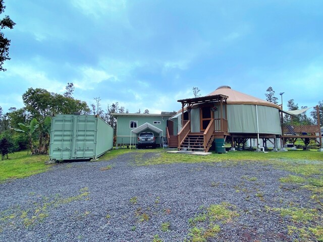 16-1824 Hopue Rd, Mountain View, HI 96760 - view of front of house with stairway