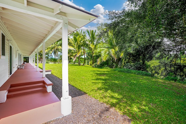 4875-J Kapaka St Unit 13D, Princeville, HI 96722 - view of grassy yard featuring covered porch