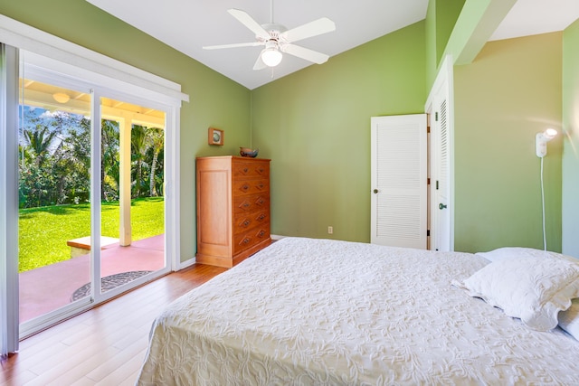 4875-J Kapaka St Unit 13D, Princeville, HI 96722 - bedroom with access to outside, vaulted ceiling, wood finished floors, a closet, and ceiling fan