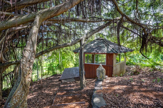 4875-J Kapaka St Unit 13D, Princeville, HI 96722 - view of outbuilding with a view of trees