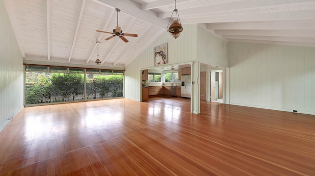 5118 Lawai Rd, Koloa, HI 96756 - unfurnished living room featuring light wood finished floors, beamed ceiling, a ceiling fan, high vaulted ceiling, and wooden walls