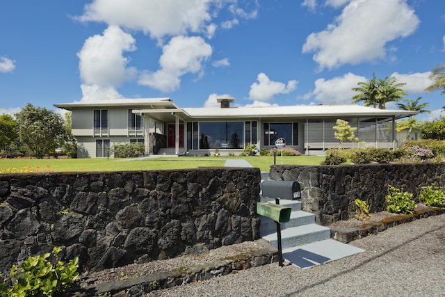 114 Kupaa St, Hilo, HI 96720 - view of front of home featuring a front yard, stucco siding, and a sunroom