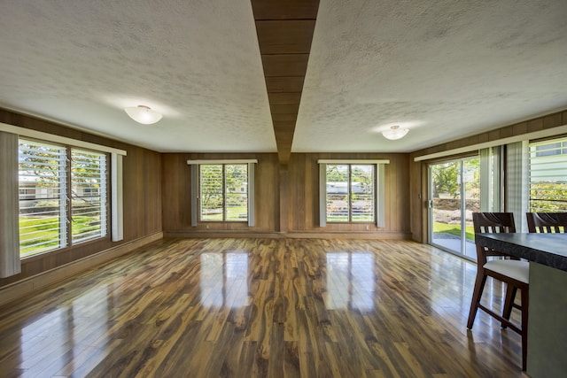 114 Kupaa St, Hilo, HI 96720 - unfurnished room featuring a textured ceiling, hardwood / wood-style flooring, and wooden walls