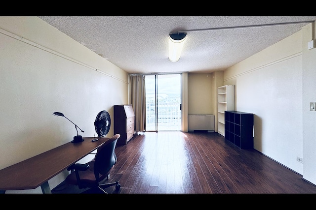 101 Hilo Lagoon Ctr Unit 421, Hilo, HI 96720 - home office with a wall of windows, wood-type flooring, and a textured ceiling