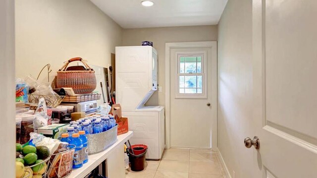 6573-E Puupilo Rd, Kapaa, HI 96746 - laundry room with estacked washer and dryer, light tile patterned flooring, and baseboards