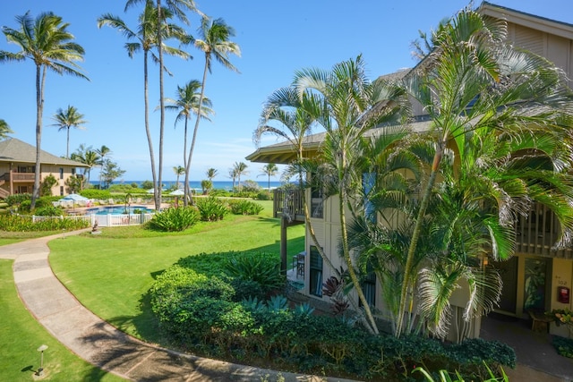 4460 Nehe Rd Unit 203, Lihue, HI 96766 - surrounding community featuring a yard and a swimming pool