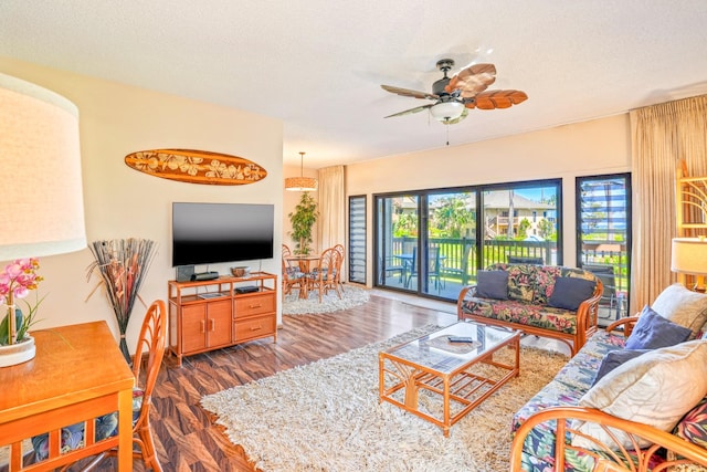4460 Nehe Rd Unit 203, Lihue, HI 96766 - living room featuring wood finished floors, a ceiling fan, and a textured ceiling